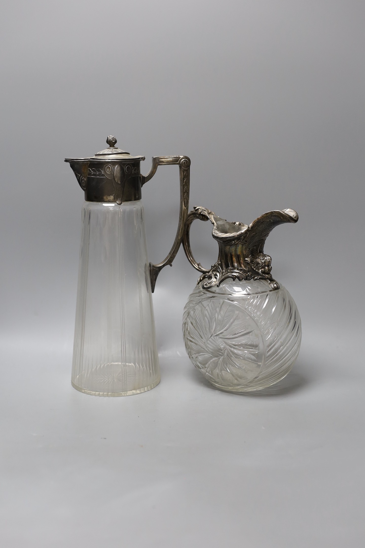 A WMF style plate mounted claret jug and another, a sauce boat sugar bowl compact and mirror (6), Claret jug 29 cms high